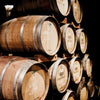 A rack of oak barrels used in the bourbon aging process.